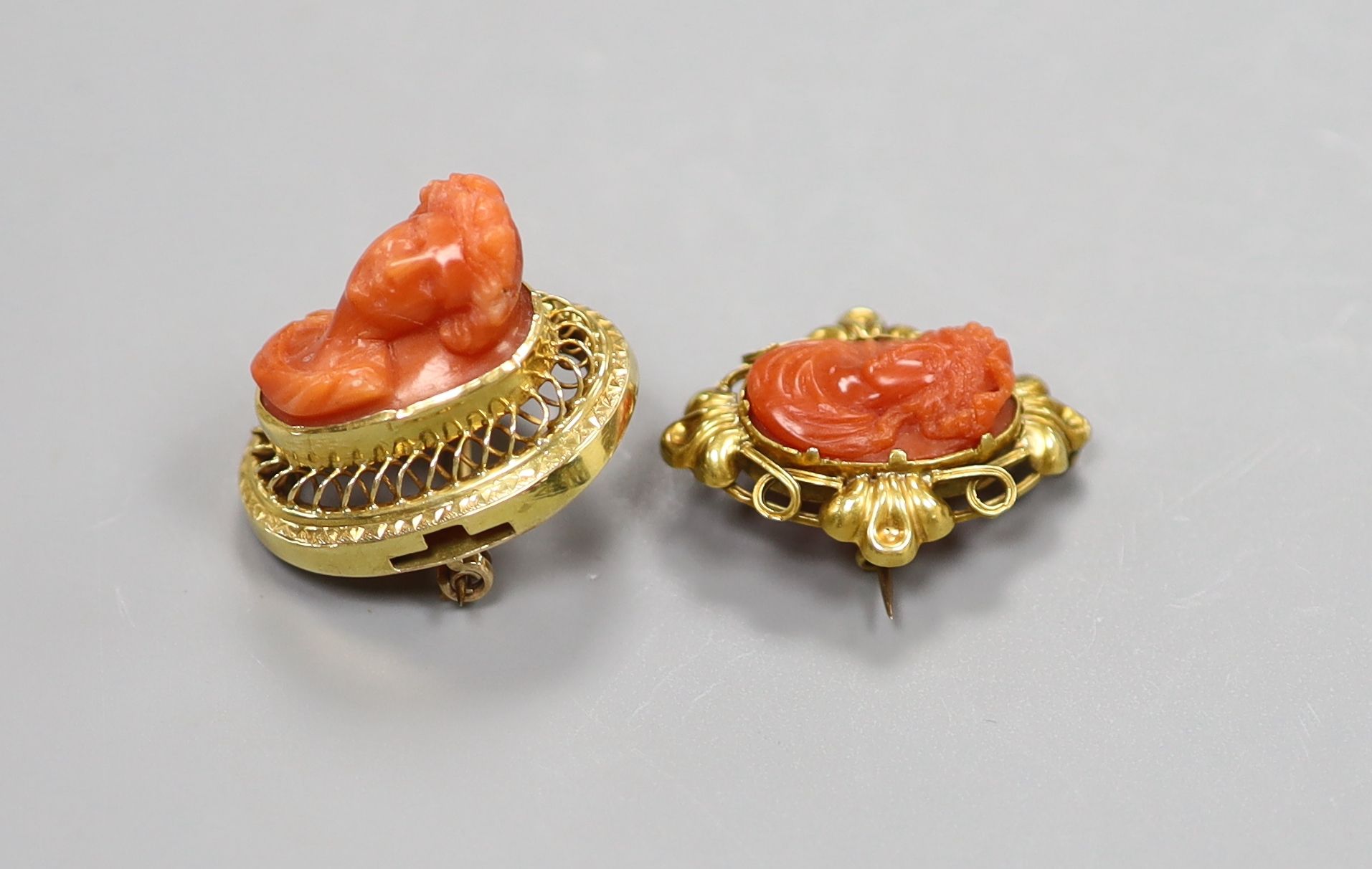 Two 19th century yellow metal and coral set oval brooches